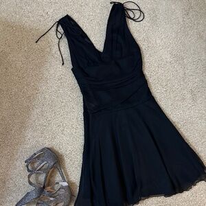 Black sleeveless deep V dress